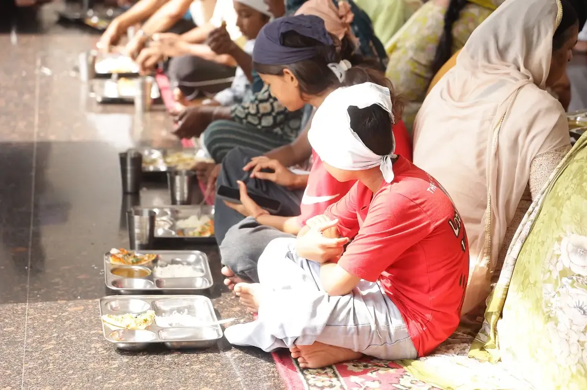 Children sharing a Langar meal