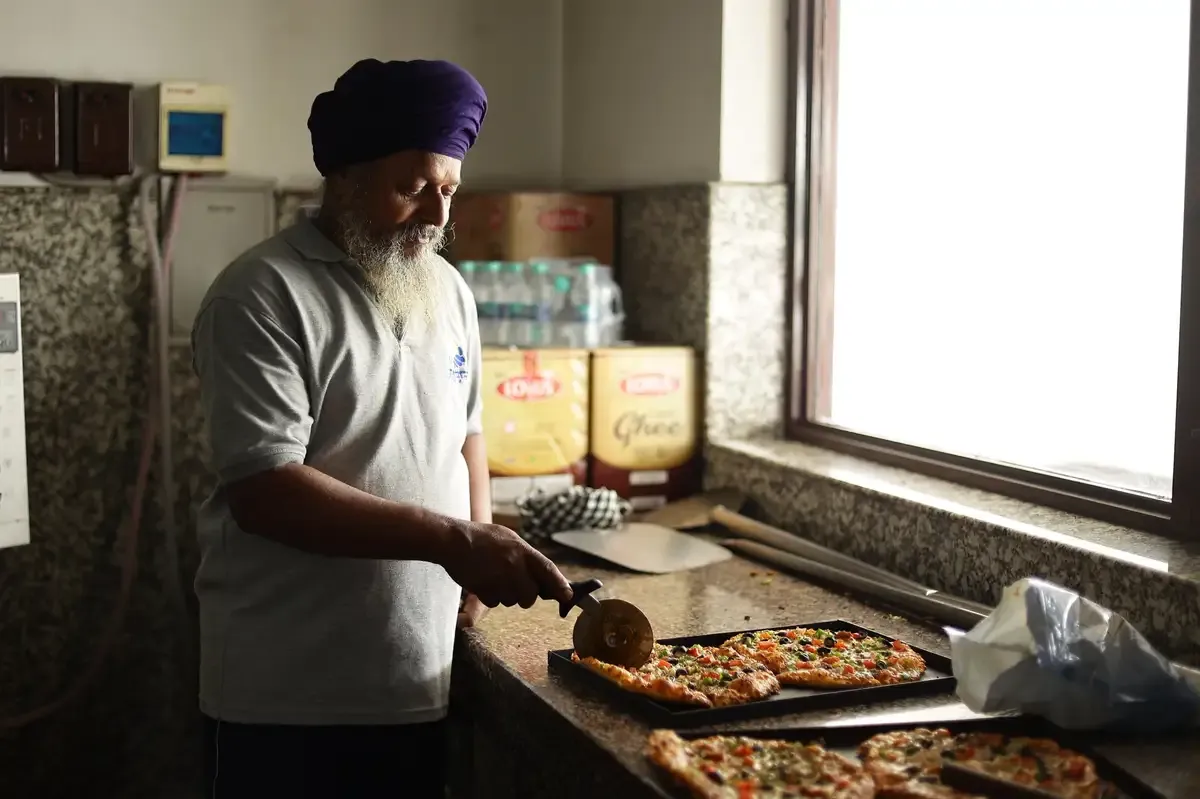 Sunday Pizza Langar being prepared